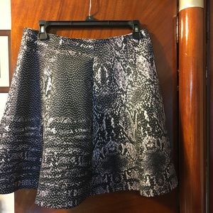 Black and grey above knee skirt.